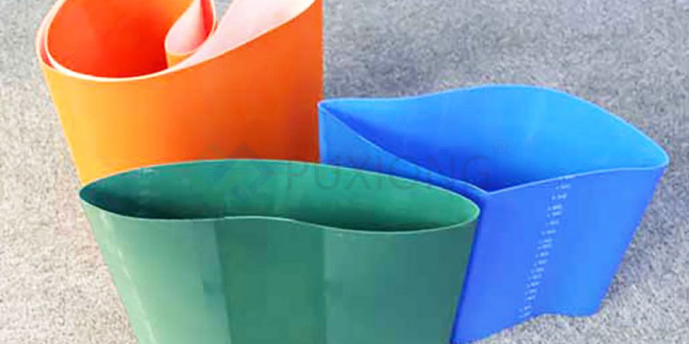 What is the relationship between the service life of the industrial belt and the material